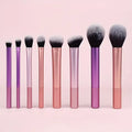Eight-piece synthetic makeup brush set with wooden handles, laid out in a row